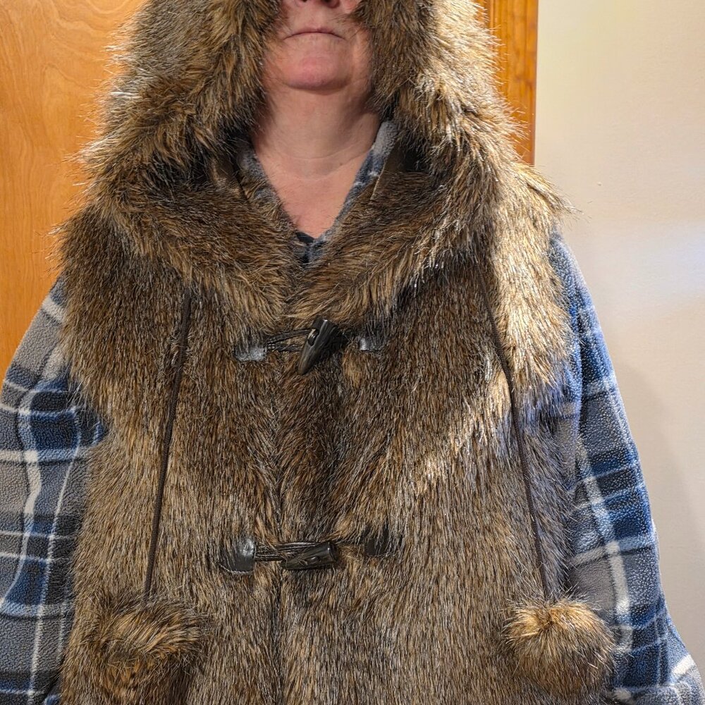 Pamela McCoy faux vest with hood and pom poms